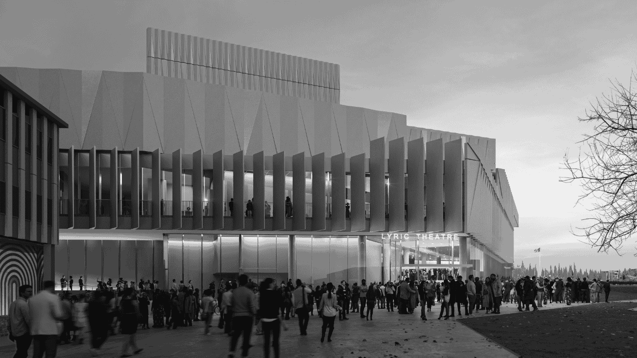 Modern theatre building with vertical fins, glass entrance, and a crowd gathered outside on a cloudy day.